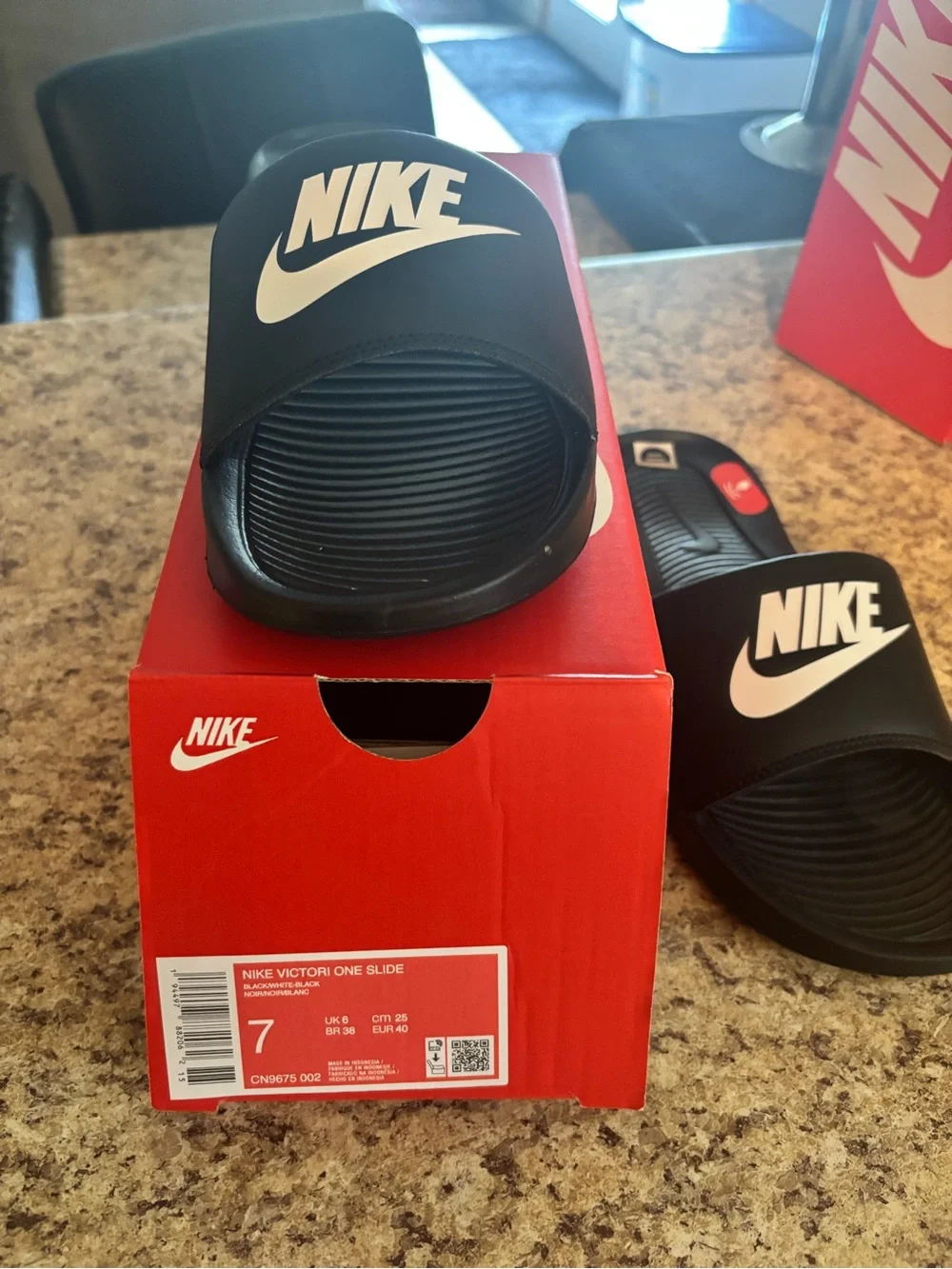 Nike Black Slides with White Swoosh Logo